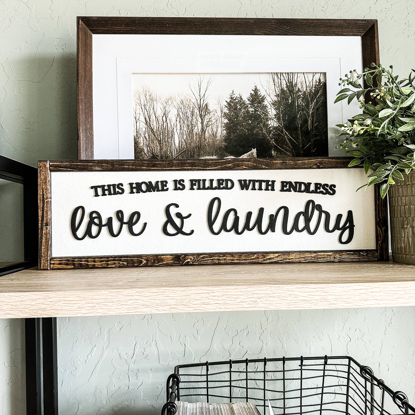 'This Home Is Filled With Love And Laundry' Wooden Sign