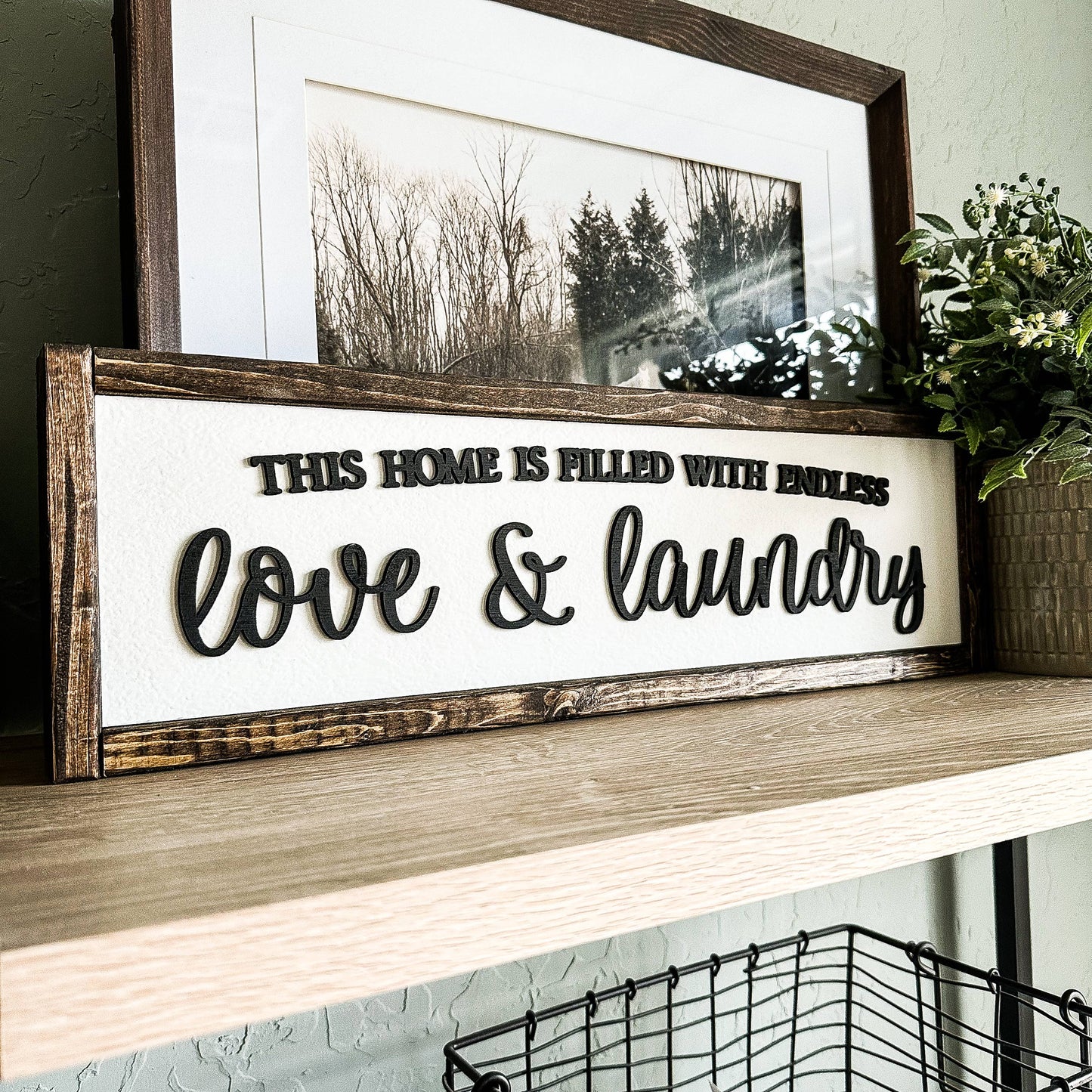 'This Home Is Filled With Love And Laundry' Wooden Sign